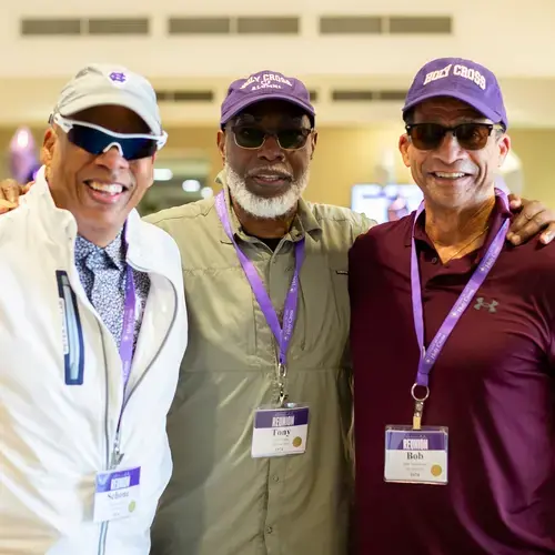 three men smiling at the camera