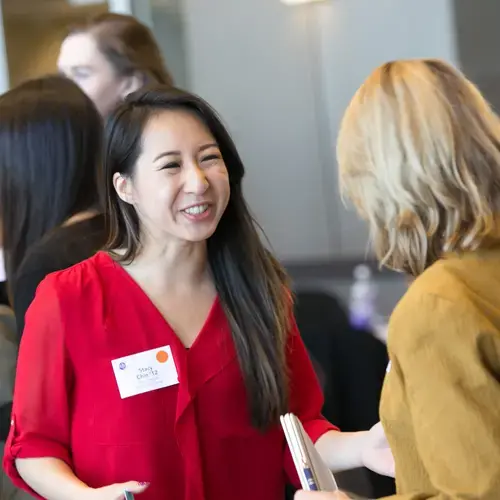 a student talking with an alum