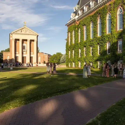 alumni gathering on the lawn in front of fenwick hall