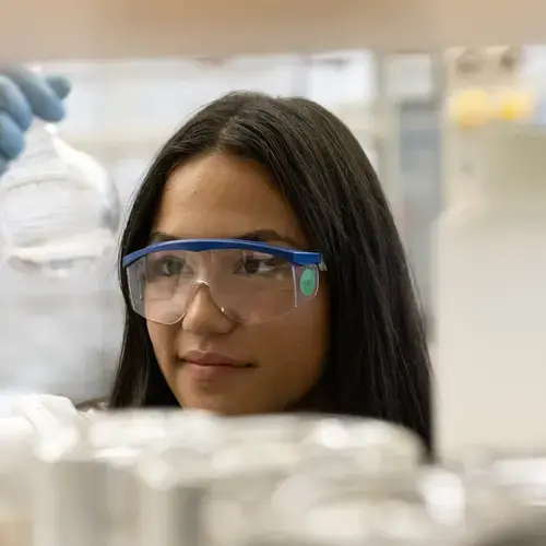 A student performs science research in Andre Isaacs lab in 2023.