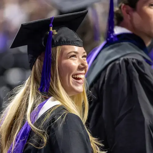 A student smiles at Holy Cross commencement 2026