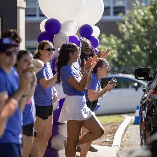 Students line the campus road during move-in day 2026