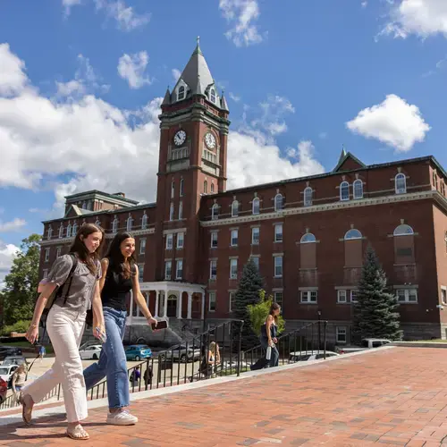 Two students climb the library steps on the first day of classes in 2026 at Holy Cross