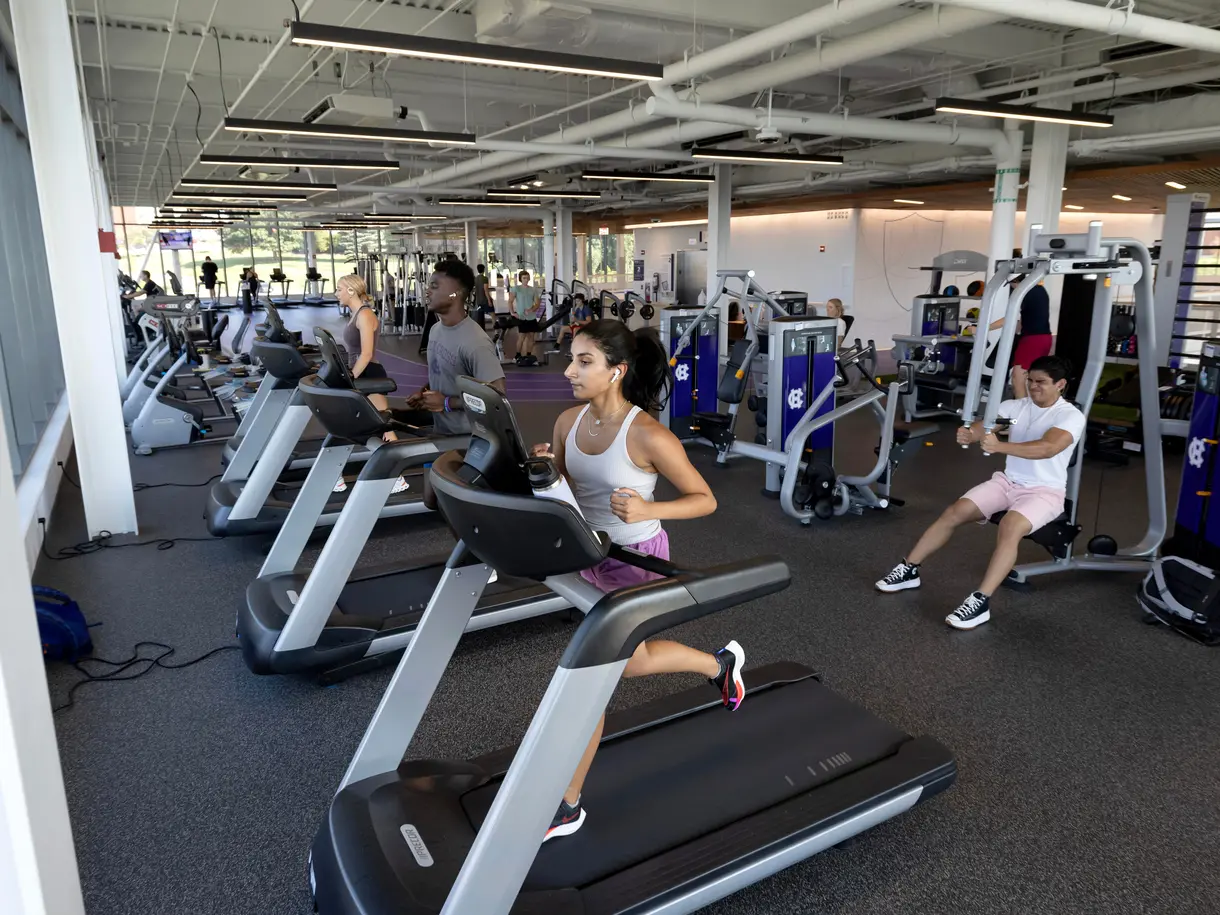 Students in The Jo using treadmills and other workout equipment.