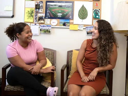 College of the Holy Cross Assistant Director of Admissions Cortney Lima chats with Shakira Suazo Valdez ’27 in her office