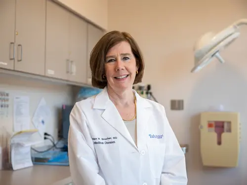 Woman in an doctor's office in a lab coat