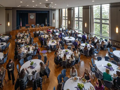 A Ciocca Center event in the Hogan Ballroom with people sitting around tables.