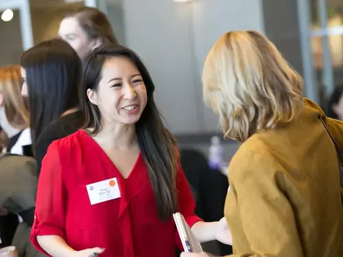 a student talking with an alum