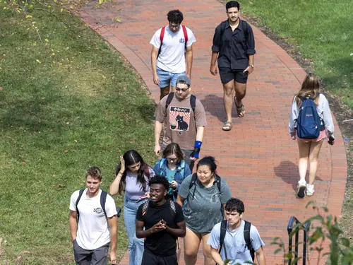 Students walking from class to Hogan