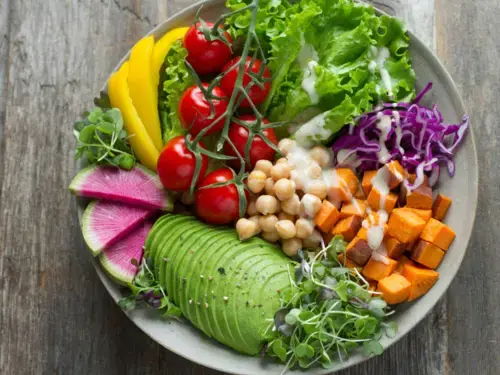 Colorful grain bowl filled with assorted vegetables