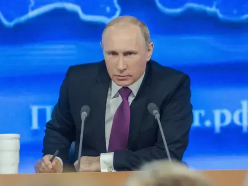 Putin bent over a podium