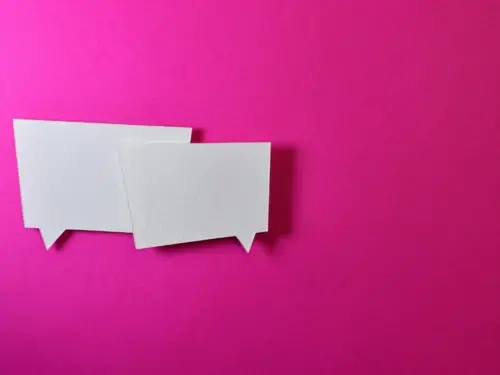 Two speech bubbles against hot pink background 