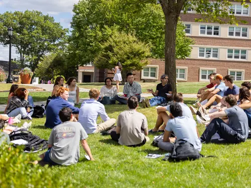 Students in a class session outside 