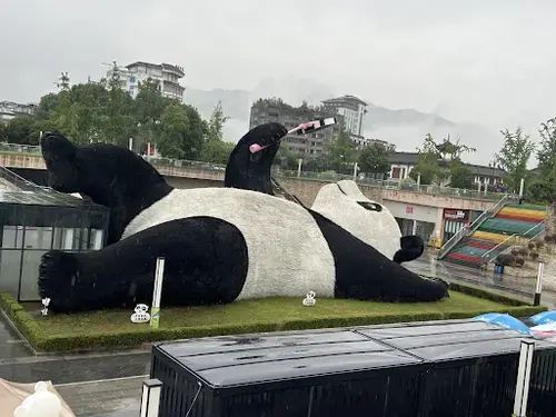 A massive panda art installation on a rooftop