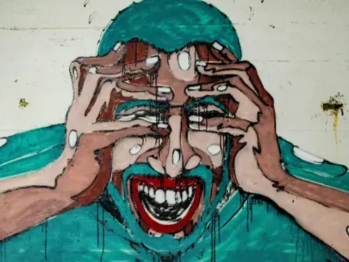 A painting of a man with his head in his hands