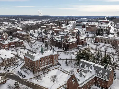 A snowy drone shot of the Holy Cross campus