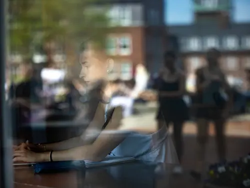 A student studies in the Hogan Campus Center on the Holy Cross campus
