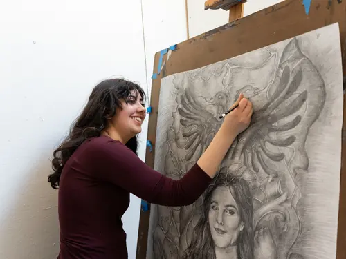 Sophie Sundaram, a Holy Cross Fenwick Scholar, working on his thesis