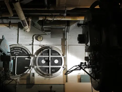 Old boiler doors are on display in the boiler room in Kimball Hall.