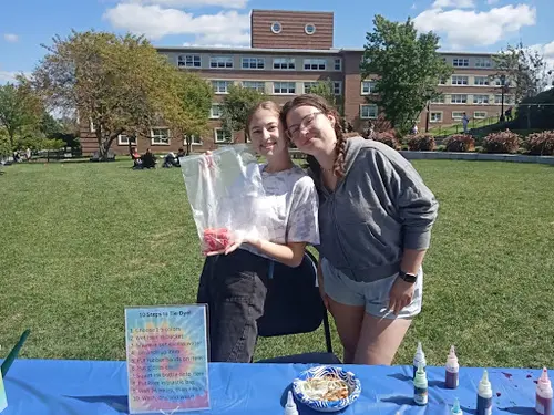 DREAM mentors at a table during a campus event