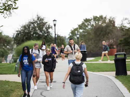 Students walk along Easy Street along the Hoval