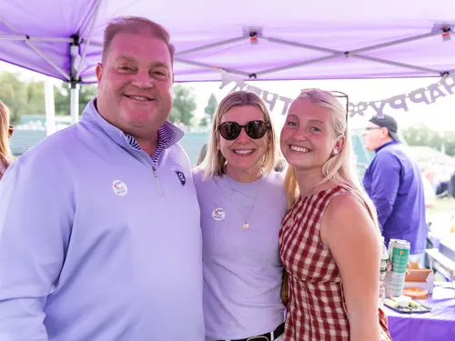 A student and her family pose during Family Weekend 2026 at Holy Cross