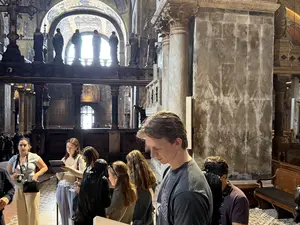 Professor and Chair of the Department of Visual Arts at Holy Cross David Karmon leads students during a Maymester in Venice, Italy between May 20th and 30th, 2025. 