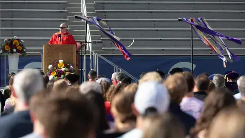 A member of the Jesuit Community addresses the student body at the College of the Holy Cross.