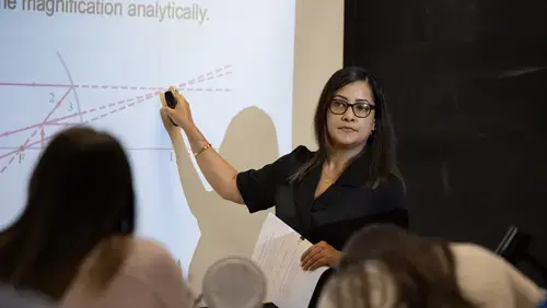 Dr. Chakdar teaching in front of class
