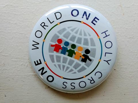 One World, One Holy Cross logo