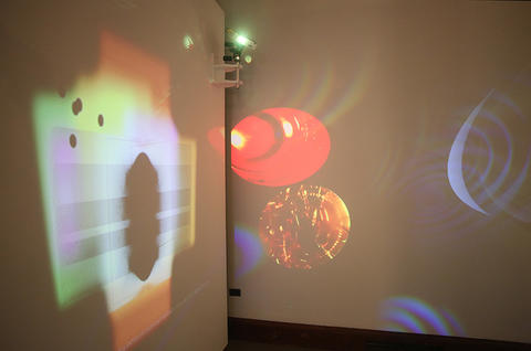 Multi-colored light projections, crystal refractions, and video.