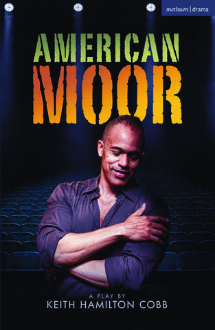 A man wearing a black shirt crosses his arms in front of him and looks down at the ground. He is standing in front of many rows of empty theatre seats. The title of the play "American Moor" is visible along with the words "a play by Keith Hamilton Cobb."