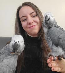 Headshot of Suzanne Gray holding two birds