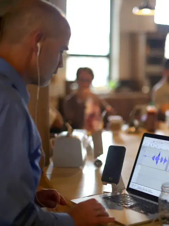 Ed O'Donnell editing his podcast on his computer