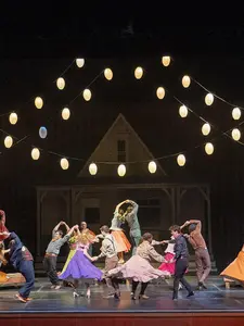 Theatre students dancing on stage in production of Oklahoma!