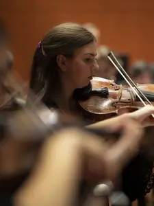 The Holy Cross Orchestra rehearses before celebrating the 50th Anniversary of Coeducation with a concert at the Luth Concert Hall on November 16, 2022 at the Prior Performing Arts Center in Worcester, Massachusetts.