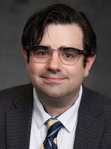 A headshot for Michael Quinn