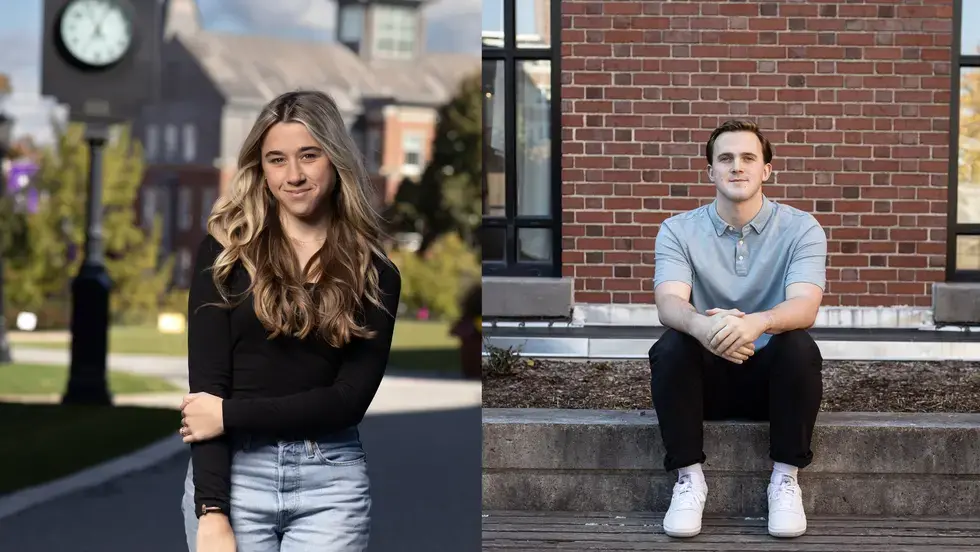 Female and male students in front of brick buildings. 