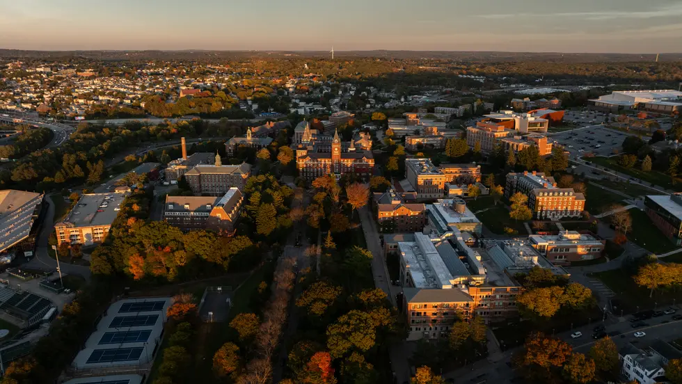 Aerial view of Holy Cross campus at sunset in the fall