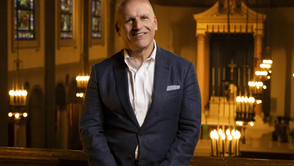 Man in the aisle of a church