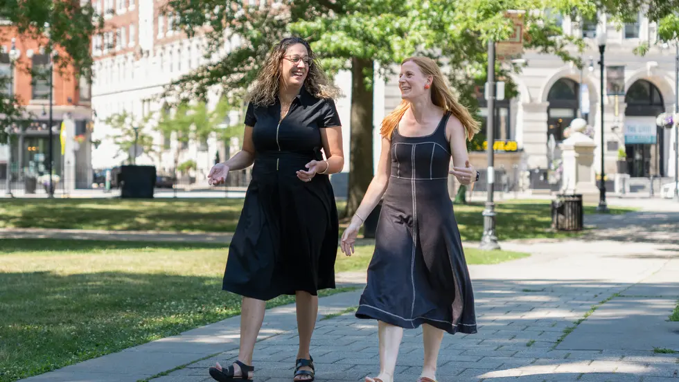 Two women walking in the Worcester Common