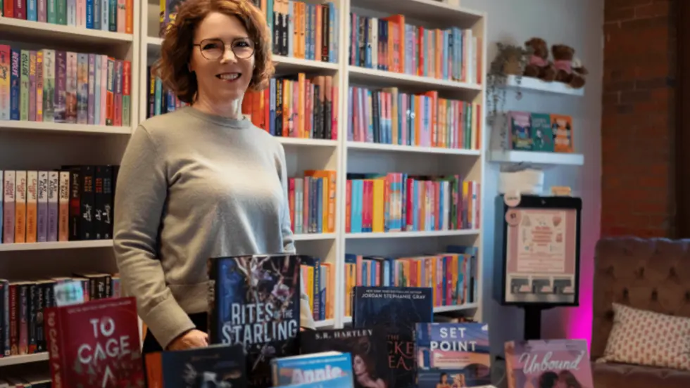 Paige Reynolds standing in a bookstore