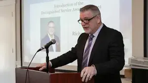 a man accepting an award