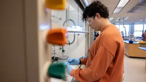 a student at holy cross in a chemistry lab
