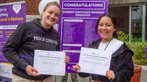 Students hold completed certificate in business fundamentals from Holy Cross