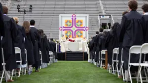 A view of the stage and 2026 graduates at the spring 2026 Baccalaureate Mass at Holy Cross