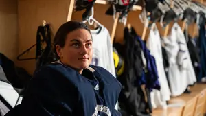 Abby Hornung in the Holy Cross hockey locker room
