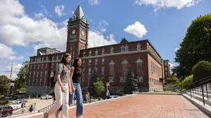 Students climbing steps of Dinand library outside of Fenwick